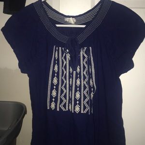 blue tied up shirt with crochet details